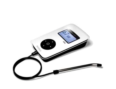 Portable dental intraoral camera device with controls and attached cable on white background.